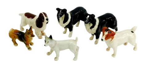 A group of Beswick and other pottery dogs, to include Border Collies, Terrier, etc.