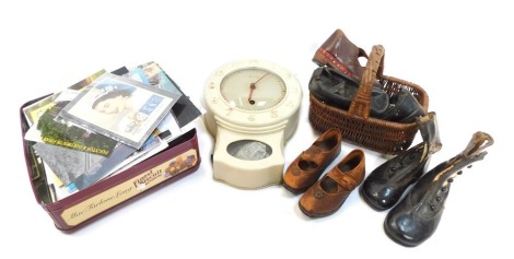 Various 19thC children's leather shoes and boots, together with a child's wicker flower basket, a 1950s Smiths eight day wall clock, postcards, etc.