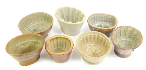 A group of 19thC brown glazed jelly moulds, of differing designs and styles.