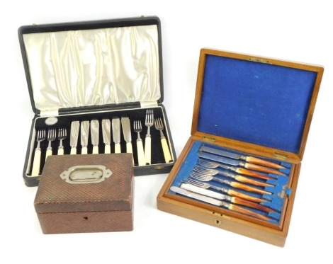 A set of early 20thC fish knives and forks, cased, together with an early 20thC leather bound jewellery box. (2)