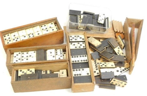 Various bone part domino sets, some contained in wooden cases.