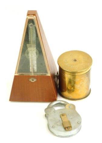 Trench art. A shell case converted to a trinket box and cover, 10cm high, together with a Belfrey Brand padlock, and a metronome.