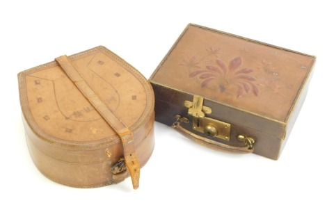 A 1920s pressed leather jewellery case, the top decorated with leaves, etc., enclosing a fitted interior, 18.5cm wide, together with a leather collar box modelled as a horseshoe.