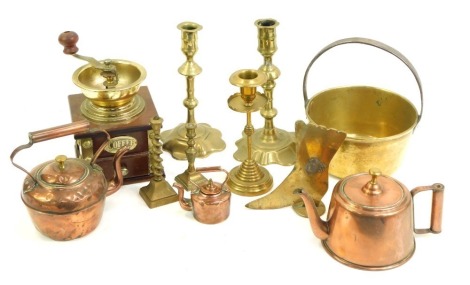 A group of copper and brass ware, to include coffee bean grinder, 18thC style brass candlesticks, miniature copper kettle, small brass preserve pan, Arts & Crafts style brass candlestick, etc. (1 tray)