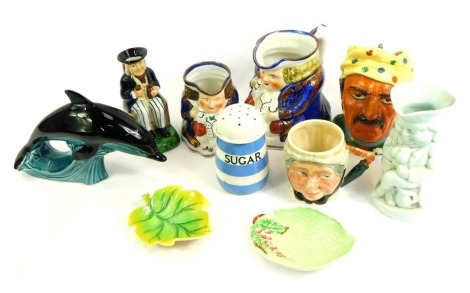 A group of character jugs and other ceramics, to include a Lancaster Sandland small character mug, Poole pottery dolphin, TG Green & Co Cornishware sugar sifter, trinket dishes, etc. (1 tray)