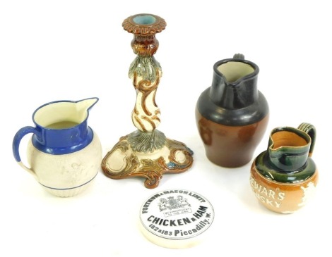 A group of Victorian and later pottery, to include stoneware jugs, a Fortnum and Mason Limited chicken and ham pot lid, relief moulded candlestick, 24cm high, etc. (a quantity)