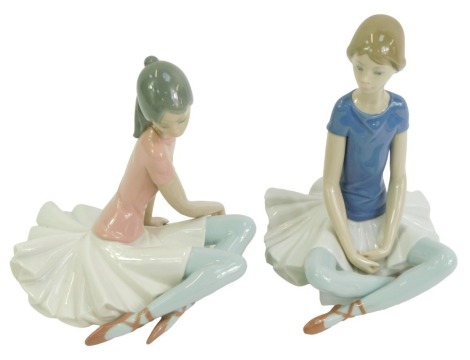 Two Lladro porcelain figures, modelled as seated ballerinas, 19cm high.