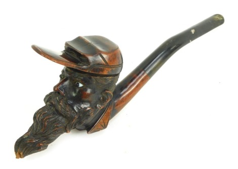 An American 19thC pipe, formed as a Civil War military gentleman, with carved head, with glass eyes, 23cm long.