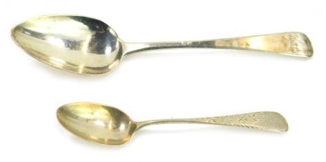 Two 19thC silver spoons, comprising a George IV silver Old English pattern serving spoon, monogram engraved, William Bateman, London 1825, and a teaspoon, with engraved decoration, reserve further engraved Owen, stamped sterling, 2.74oz. (2)