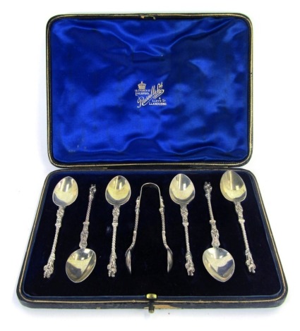 A set of six Victorian silver apostle coffee spoons, and a pair of sugar tongs, Richard Martin and Ebenezer Hall, Sheffield 1897, 3.14oz, in fitted case.