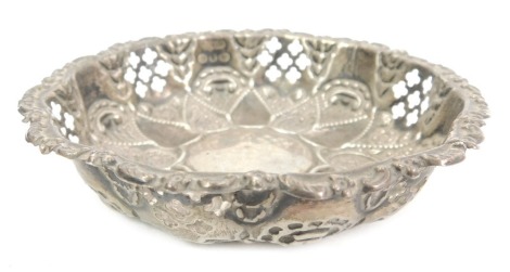 A Victorian silver dish, with pierced and embossed design in the Eastern style, Birmingham 1899, 0.67oz.