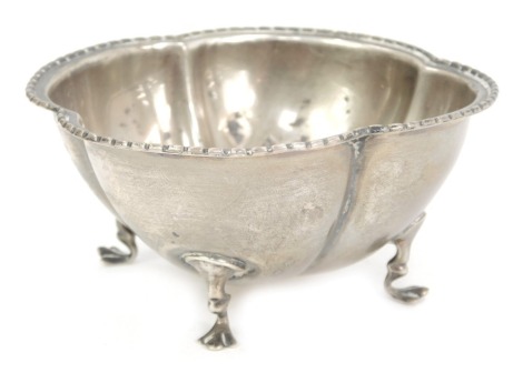 An George VI silver bonbon dish, of four sectional fluted design with a ribbed border, on four claw feet, maker EJB, Birmingham 1945, 1.55oz. .