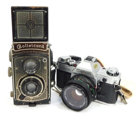 Two cameras, comprising a Rolleicord Frank & Heidecke TLR camera, and a Canon AE1 SLR camera. (2)