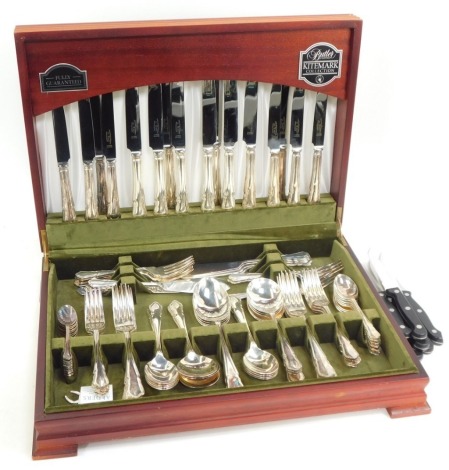 A Butler's silver plated twelve place setting canteen of cutlery, retailed by Butler's of Sheffield, in presentation mahogany case, together with eight stainless steel steak knives.