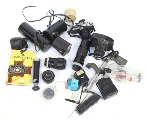 A group of camera equipment, comprising Vivitar automatic extension tube, a Canon AE1 camera, Canon FD100 200mm lens, Vivitar Skylark 1A lens, Canon 35278 lens, flashes, tripods and other accessories. (1 box)