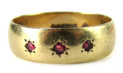 A 9ct gold gypsy ring, set with three illusion set rubies, London 1891, ring size U½, 4.1g all in.