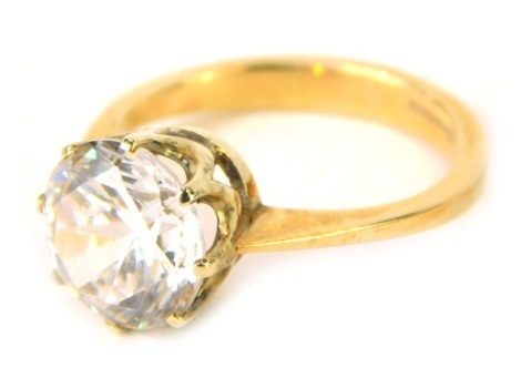 A 9ct gold dress ring, set with an imitation diamond, in eight claw setting, 9.8mm wide, size N½, 4.2g all in.