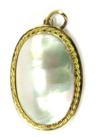 A blister pearl pendant, the oval blister pearl in a rub over setting with rope twist border and pendant loop and open back, yellow metal stamped 585, 3.5cm high, 9g all in.