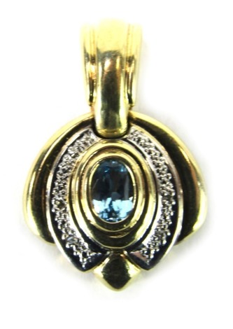 An aquamarine pendant, bicolour with a white gold outer border, yellow metal stamped 585, 2.5cm high, 4.3g all in.