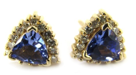 A pair of tanzanite and diamond triangle cut stud earrings, each with single pin back with butterfly backs, in rose gold, unmarked, 2.2g all in.