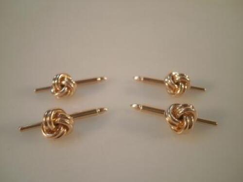 Four 14K gold shirt studs