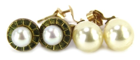 Two pair of cultured pearl earrings, each yellow metal set, comprising a pair of drops, 1cm high, stamped 375, and a pair of studs, yellow metal unmarked, 3.3g all in. (4)