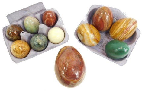 Eleven onyx and agate polished eggs, of three sizes, six 4cm high, four 7cm high, and one 10cm high.