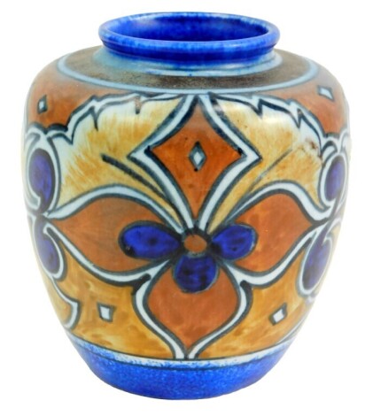 A Clews Chameleon ware pottery vase, decorated in brown with repeating flowers against a blue ground, printed mark, 11cm high.