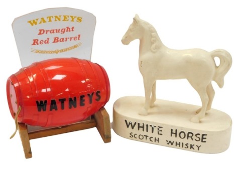 Breweriana. A White Horse Scotch Whisky advertising figure, 23cm high, and a Whatney's Draft Red Barrel Ale table lamp, 24cm high. (2) WARNING! This lot contains untested or unsafe electrical items. It is supplied for scrap or re-conditioning only. TRADE