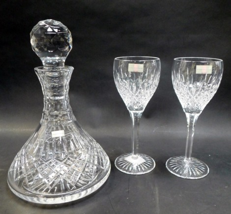 Three items of Stuart Crystal Shaftesbury pattern glass, comprising two wine glasses and a decanter and stopper, boxed.