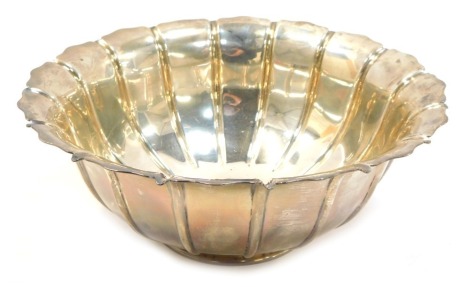 A George V silver rose bowl, with a fluted and reeded design, maker EB Limited number 562, London 1919, 24cm diameter, 19.85oz.