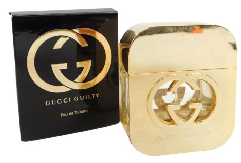 A Gucci Guilty perfume, partially used, boxed.