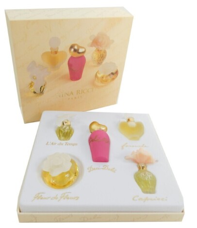 A cased set of Nina Ricci perfume miniatures, each in 2.5-6ml bottles, boxed.