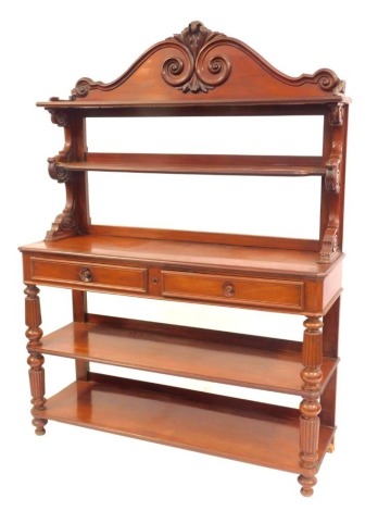 A 19thC Continental mahogany buffet, the top with a raised scroll carved back above two shelves, the base with frieze drawers above two under tiers, on turned cylindrical fluted columns, on squat turned cylindrical feet, 185cm high, 145cm wide, 47cm deep.