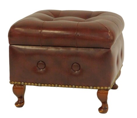 A mahogany and red leatherette stool, with buttoned top and wooden interior, 31cm high, 39cm wide, 39cm deep. The upholstery in this lot does not comply with the 1988 (Fire & Fire Furnishing) Regulations, unless sold to a known exporter or upholsterer it