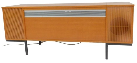 A teak cased radiogram, containing a Decca SRJ899 turntable, 56cm high, 140cm wide, 47cm deep. Buyer Note: WARNING! This lot contains untested or unsafe electrical items. It is supplied for scrap or reconditioning only. TRADE ONLY