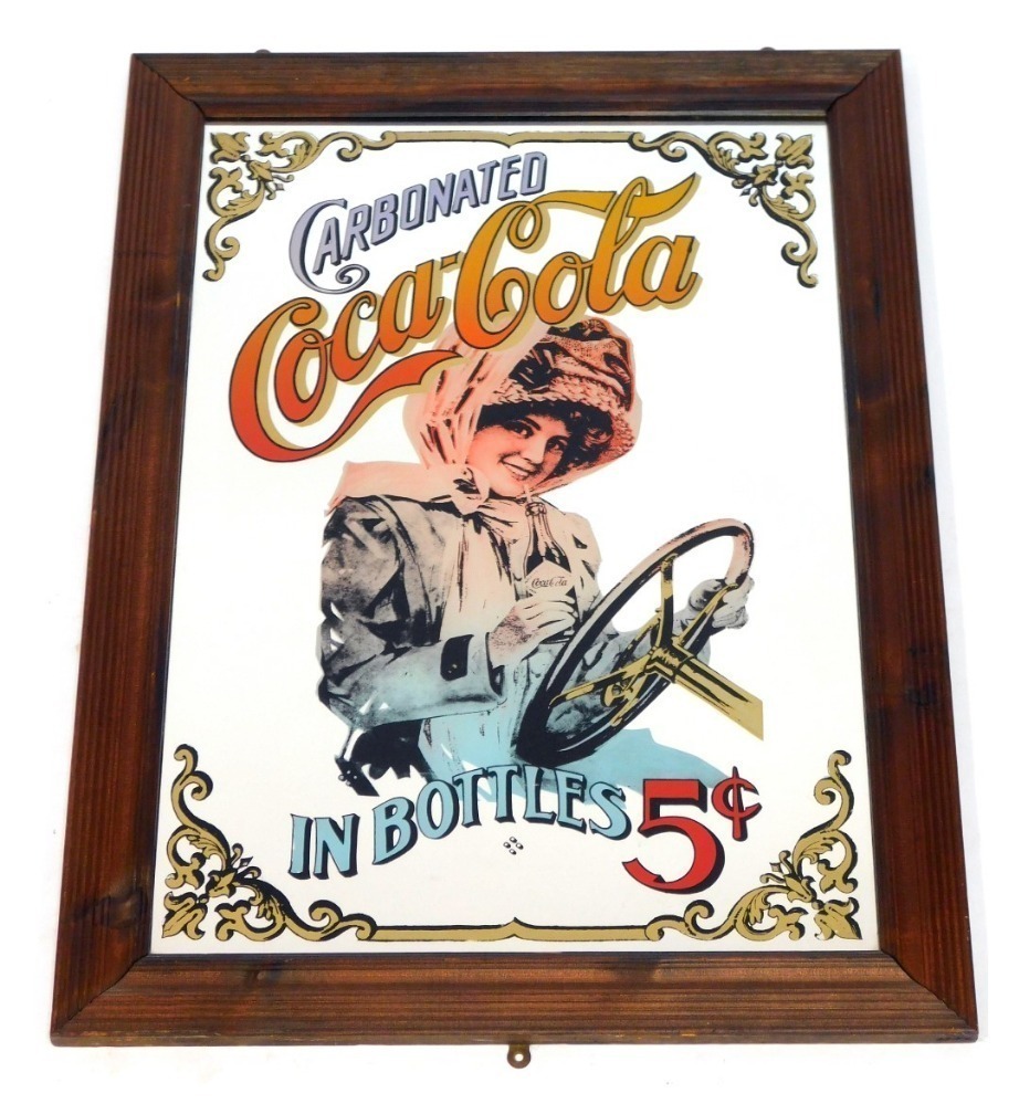 A Coca Cola advertising mirror, depicting lady wearing bonnet