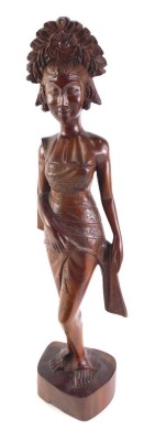 A Balinese hardwood carving of a female figure, 51cm high.