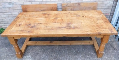 A light oak extending refectory table, with a plank top, shaped apron, on turned supports with flat H stretcher, two leaf extensions to the ends, 76cm high, 303cm long, 100cm deep. - 2