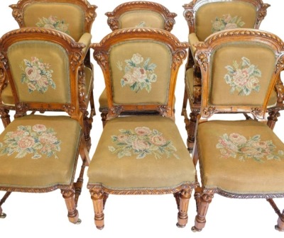 A set of fourteen Victorian elm and burr elm dining chairs, each with an arched gadrooned back with moulded leaf carved supports, with a wool work padded back and seat, on turned tapering fluted legs, with H stretcher and ceramic castors. - 3