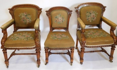 A set of fourteen Victorian elm and burr elm dining chairs, each with an arched gadrooned back with moulded leaf carved supports, with a wool work padded back and seat, on turned tapering fluted legs, with H stretcher and ceramic castors. - 4