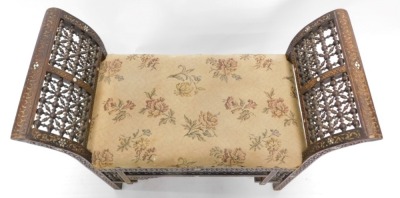 A late 19th/early 20thC Moorish design stool or window seat, inlaid with mother of pearl and with carved and with fine turned decoration, possibly retailed by Liberty, 68cm high, 87cm wide. - 2