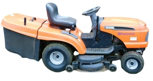 A Husqvarna CTH 210 XP petrol ride on mower, with Kawasaki engine and six speed gears.