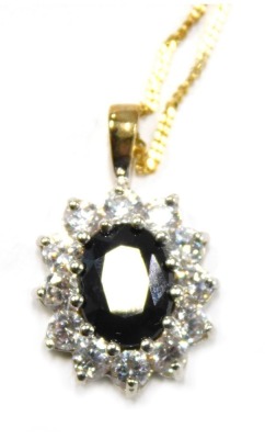 A pendant and chain, the floral cluster pendant set with imitation sapphire and diamond, 2cm high, on a fine link neck chain, yellow metal stamped 375, 42cm long, 2.2g all in, boxed.