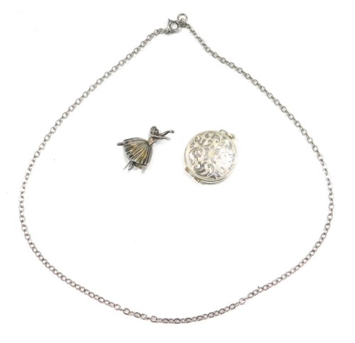 Two items of silver, comprising a silver EGD Designs ballerina brooch, on single pin back, 3cm high, and a silver floral embossed locket, 2cm high, 9.5g, and a plated chain. (3)