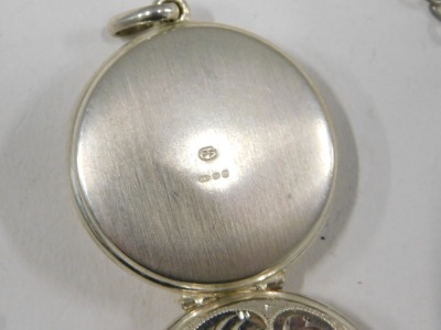 Two items of silver, comprising a silver EGD Designs ballerina brooch, on single pin back, 3cm high, and a silver floral embossed locket, 2cm high, 9.5g, and a plated chain. (3) - 3