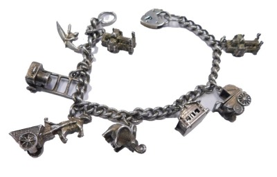 A white metal charm bracelet, stamped 925, 35.7g.