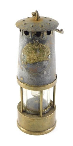 A Protector brass and steel miner's lamp, numbered 73, AF, 25cm high.