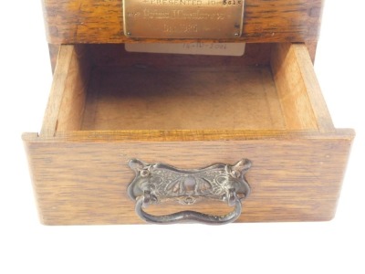 An early 20thC oak ballot box, with brass plaque engraved Presented to 5615 by Primo J Greatorex December 1925, 17cm wide. - 2