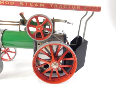 A Mamod model traction engine, painted in typical green, black and red livery, 26cm wide. - 2